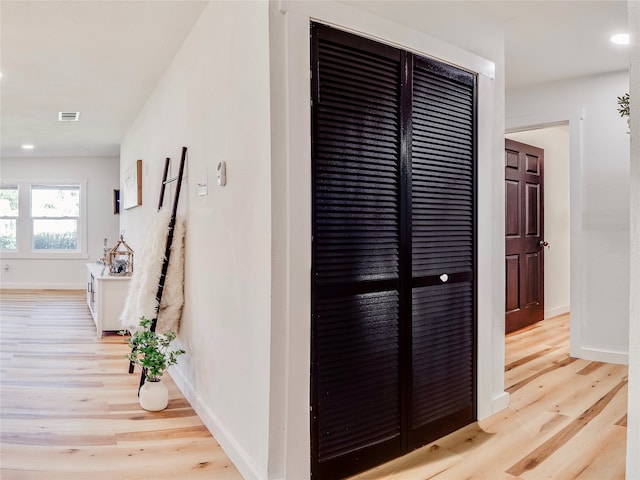 hallway featuring light wood-type flooring