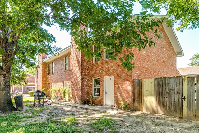 back of house with a patio