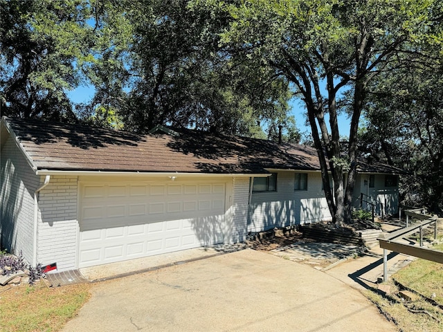 ranch-style house featuring a garage