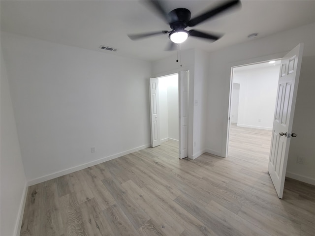 unfurnished bedroom featuring light hardwood / wood-style flooring and ceiling fan