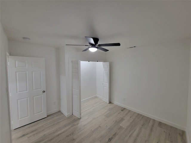 unfurnished bedroom featuring light hardwood / wood-style floors and ceiling fan