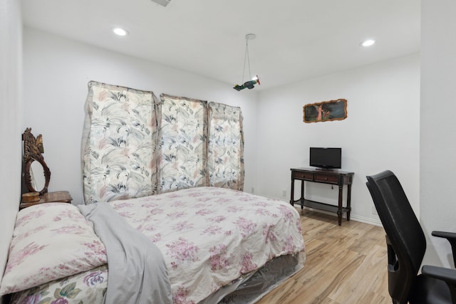 bedroom featuring light hardwood / wood-style floors