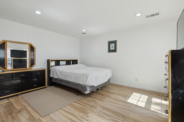 bedroom with light hardwood / wood-style flooring