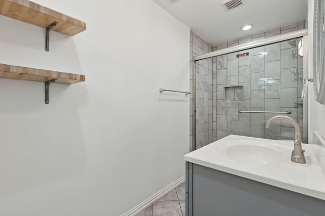 bathroom featuring an enclosed shower, vanity, and tile patterned floors