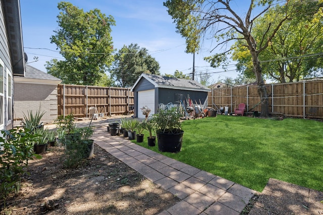 view of yard featuring a garage and an outdoor structure