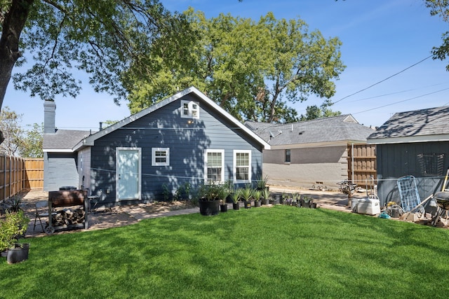 back of house with a yard