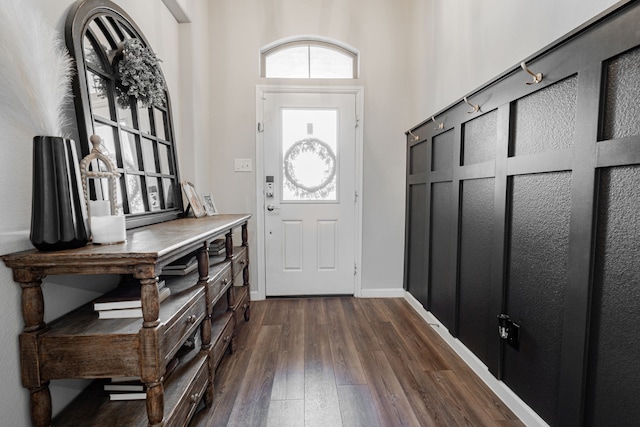 foyer with dark hardwood / wood-style flooring