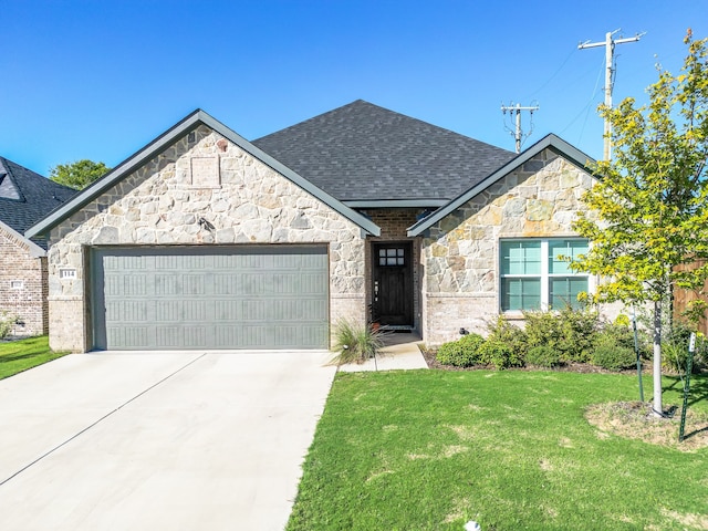 view of front of home with a front lawn and a garage