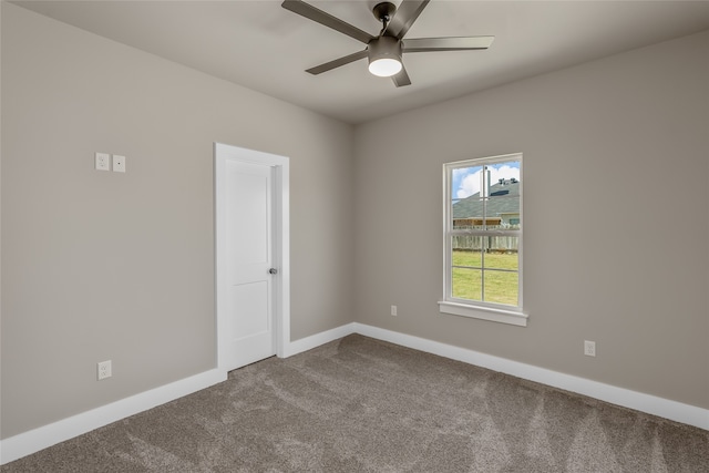 carpeted empty room with ceiling fan