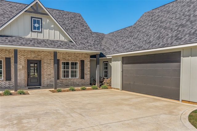 view of front of property with covered porch and a garage