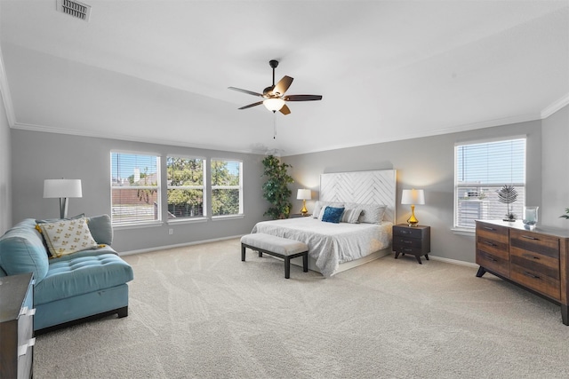 bedroom featuring ceiling fan, light colored carpet, and ornamental molding