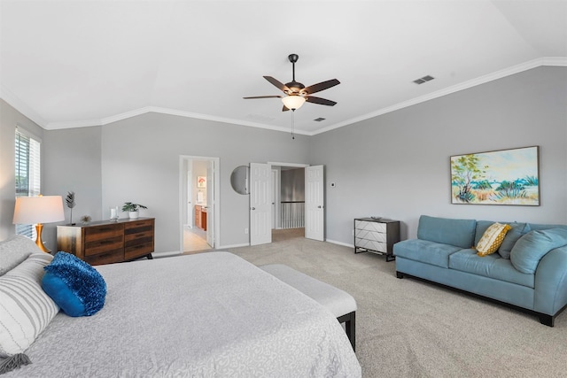 bedroom featuring ceiling fan, lofted ceiling, light carpet, crown molding, and ensuite bathroom