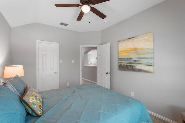 carpeted bedroom with lofted ceiling and ceiling fan