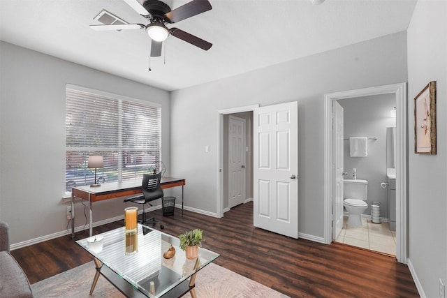 office with dark hardwood / wood-style floors and ceiling fan