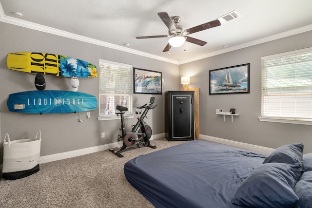 carpeted bedroom featuring ornamental molding and ceiling fan