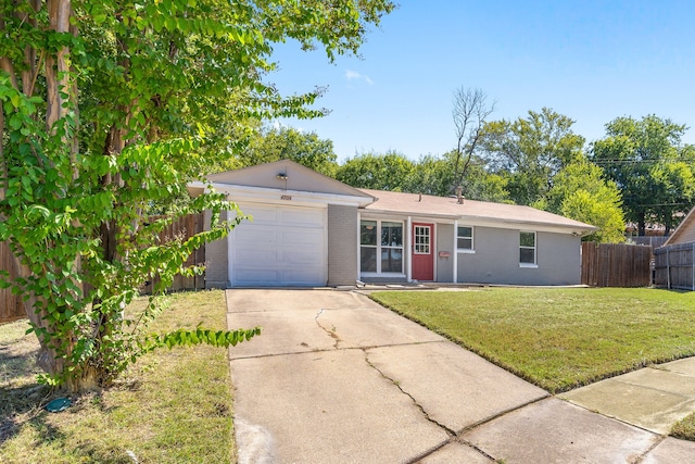 ranch-style home with a garage and a front yard