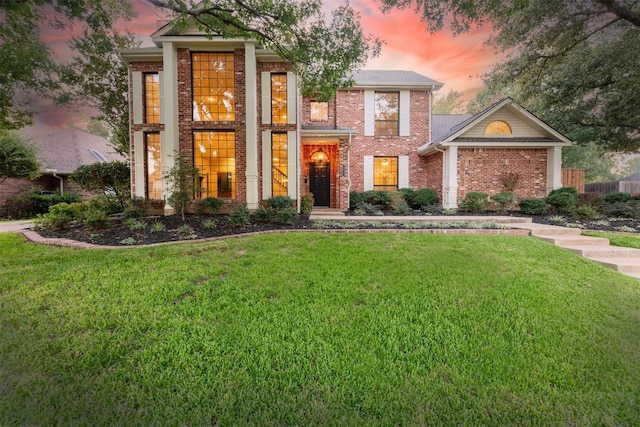 view of front of house with a lawn