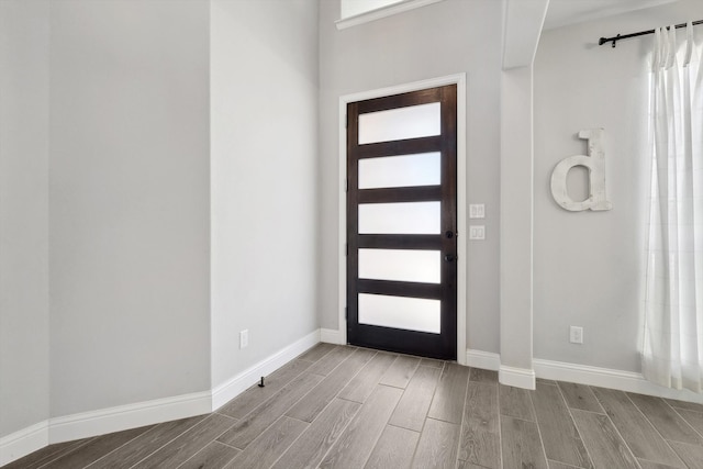 foyer entrance with light hardwood / wood-style flooring