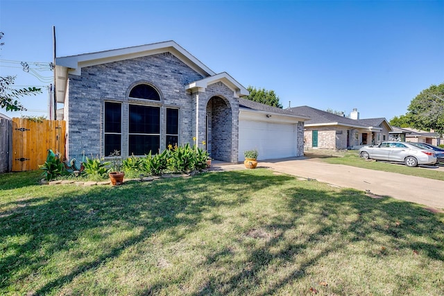 view of front of home featuring a garage and a front lawn