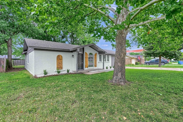 ranch-style house with a front lawn