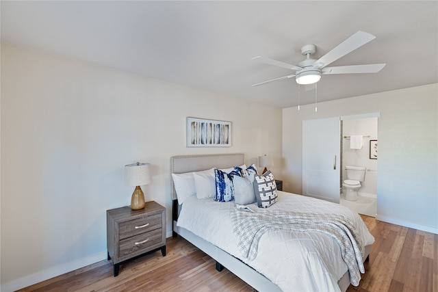 bedroom featuring hardwood / wood-style flooring, ceiling fan, and ensuite bathroom