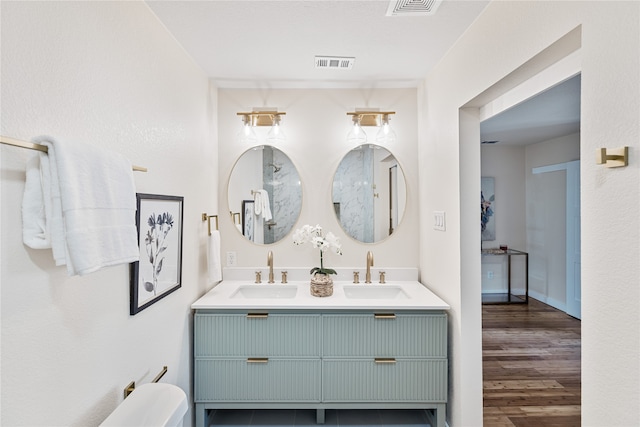 bathroom featuring vanity and hardwood / wood-style flooring