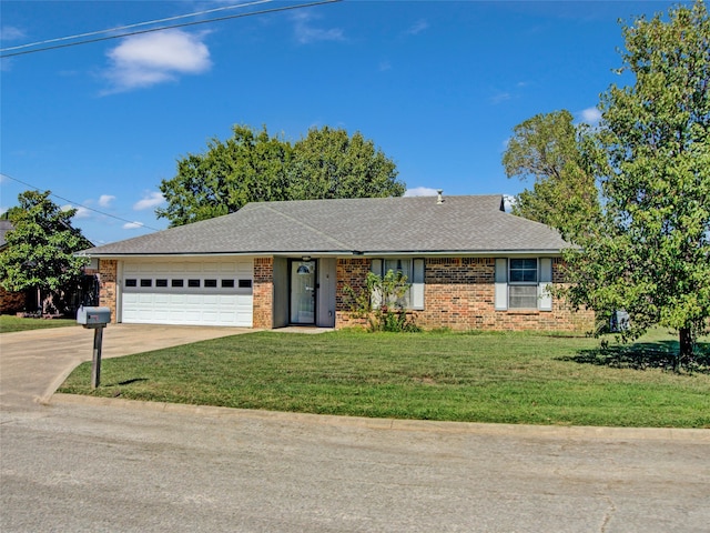 ranch-style home featuring a garage and a front yard