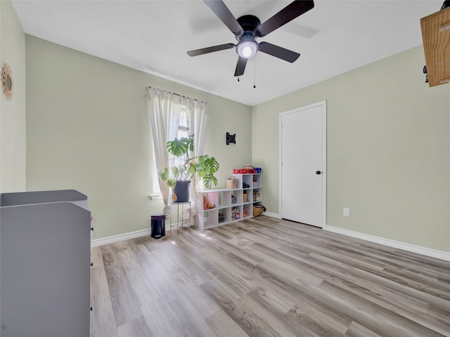 miscellaneous room with light wood-type flooring and ceiling fan