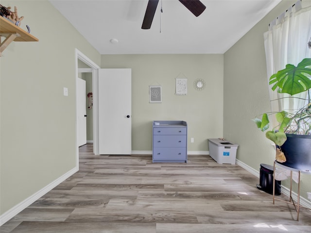 interior space featuring light hardwood / wood-style floors and ceiling fan