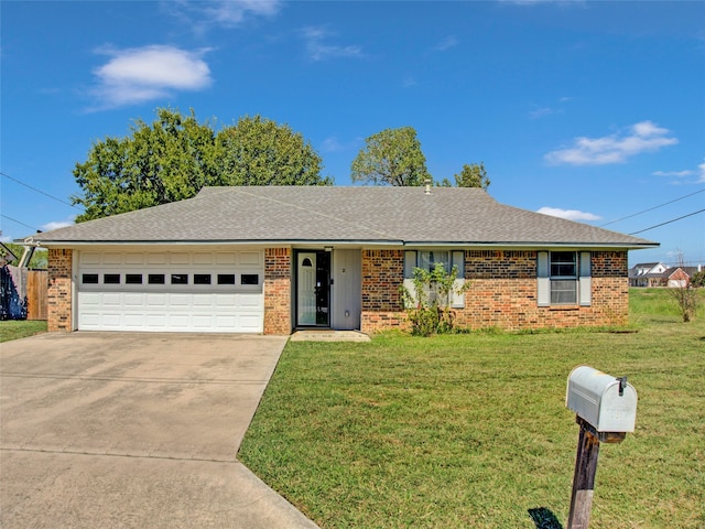 ranch-style home featuring a garage and a front lawn