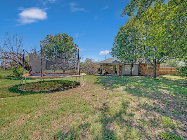 view of yard with a trampoline