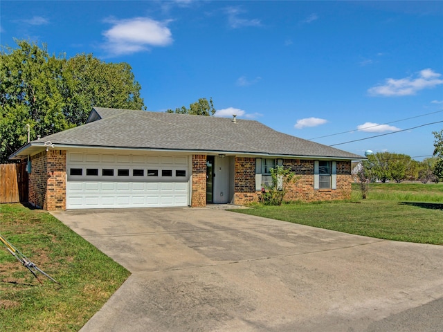 single story home featuring a front lawn and a garage