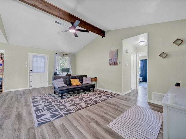 living room with light wood-type flooring, vaulted ceiling with beams, and ceiling fan