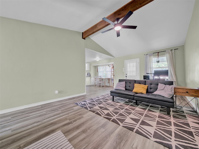 living room featuring vaulted ceiling with beams, ceiling fan, and hardwood / wood-style flooring