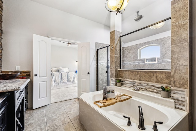 bathroom with ceiling fan, tasteful backsplash, tile patterned floors, separate shower and tub, and vanity