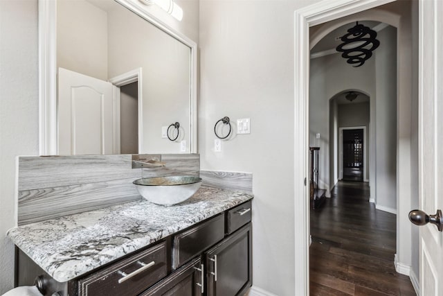 bathroom featuring vanity and wood-type flooring