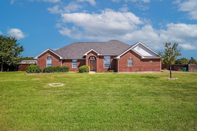 ranch-style house featuring a front lawn