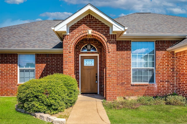 entrance to property with a yard