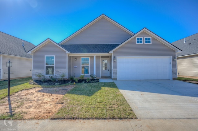 view of front of property with a garage and a front yard