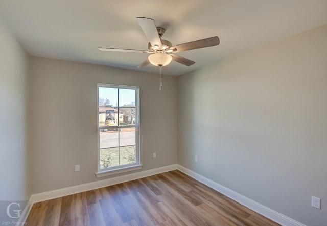 unfurnished room featuring ceiling fan and light hardwood / wood-style flooring