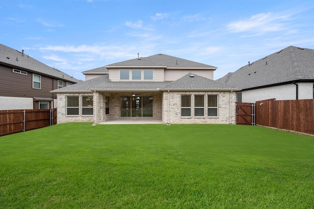 1406 Chickadee Dr, Mansfield, TX 76063 - back of property with a fenced backyard, a patio area, a shingled roof, and brick siding