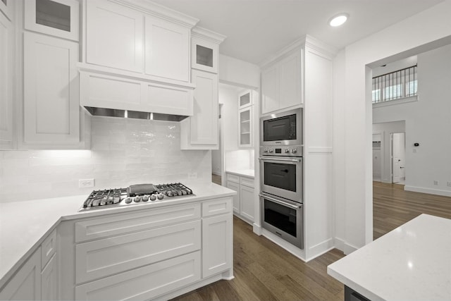 1406 Chickadee Dr, Mansfield, TX 76063 - kitchen featuring stainless steel appliances, dark wood-type flooring, light countertops, white cabinets, and recessed lighting