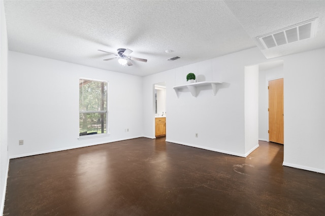 unfurnished room with a textured ceiling and ceiling fan