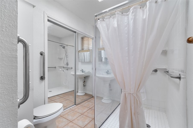 bathroom with toilet, tile patterned floors, and curtained shower