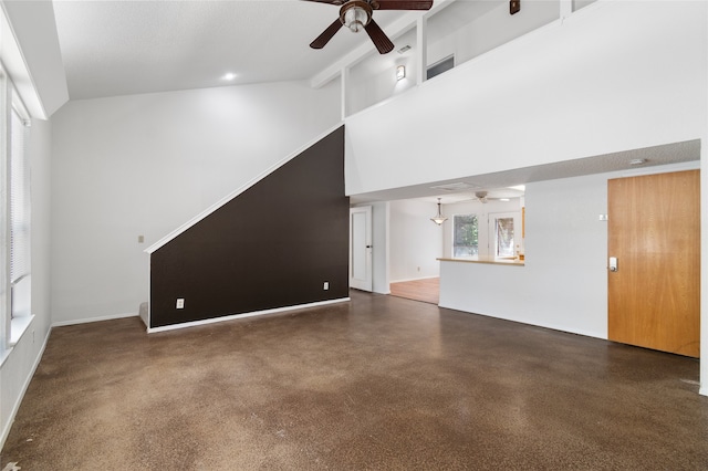 unfurnished living room featuring high vaulted ceiling, beam ceiling, and ceiling fan