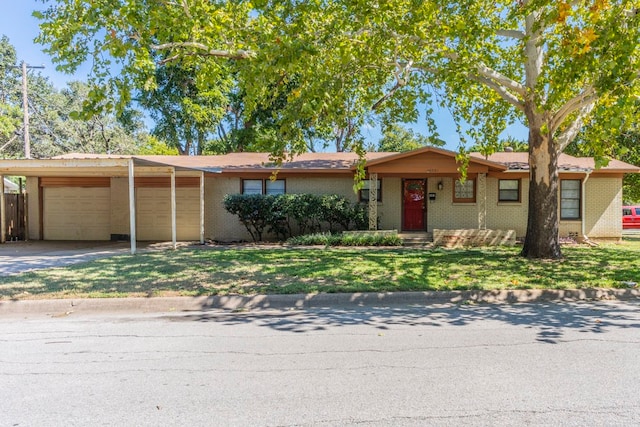 ranch-style house with a front lawn and a garage