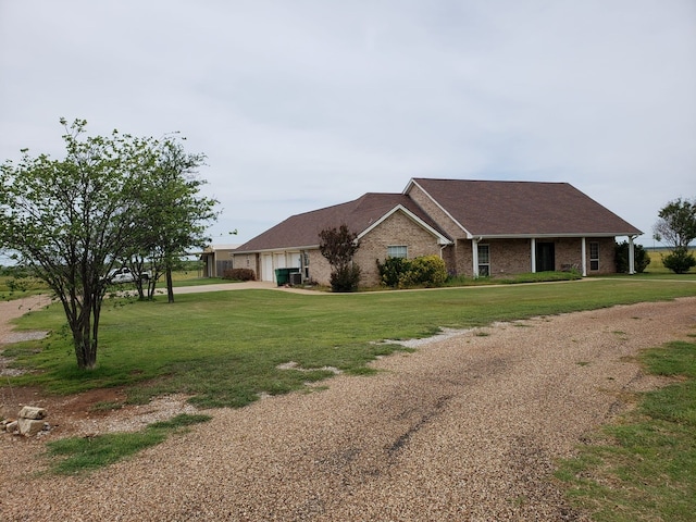 ranch-style home featuring a front lawn