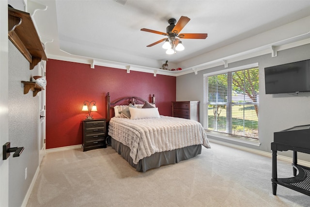 bedroom featuring light colored carpet and ceiling fan