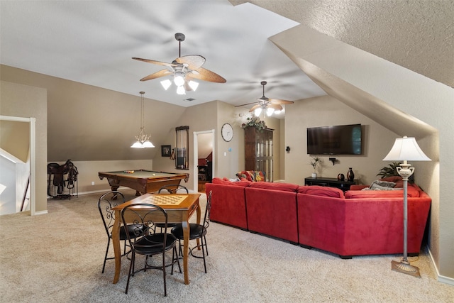 dining room featuring billiards, vaulted ceiling, carpet flooring, ceiling fan, and a textured ceiling