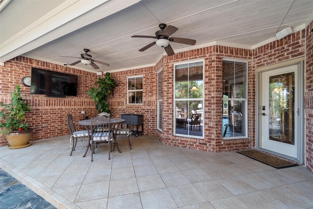 view of patio featuring ceiling fan